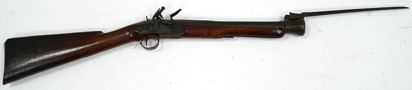 A good brass barrelled flintlock blunderbuss by Goodwin of London, c.1820, port octagonal brass barrel, Birmingham proofed, fitted with spring bayonet, signed lock with sliding safety bolt, engraved brass furniture, barr